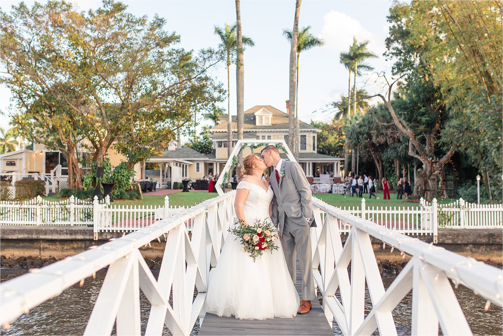 Bride and groom at spring wedding outside at Heitman House in downtown Ft Myers, Florida wedding venue