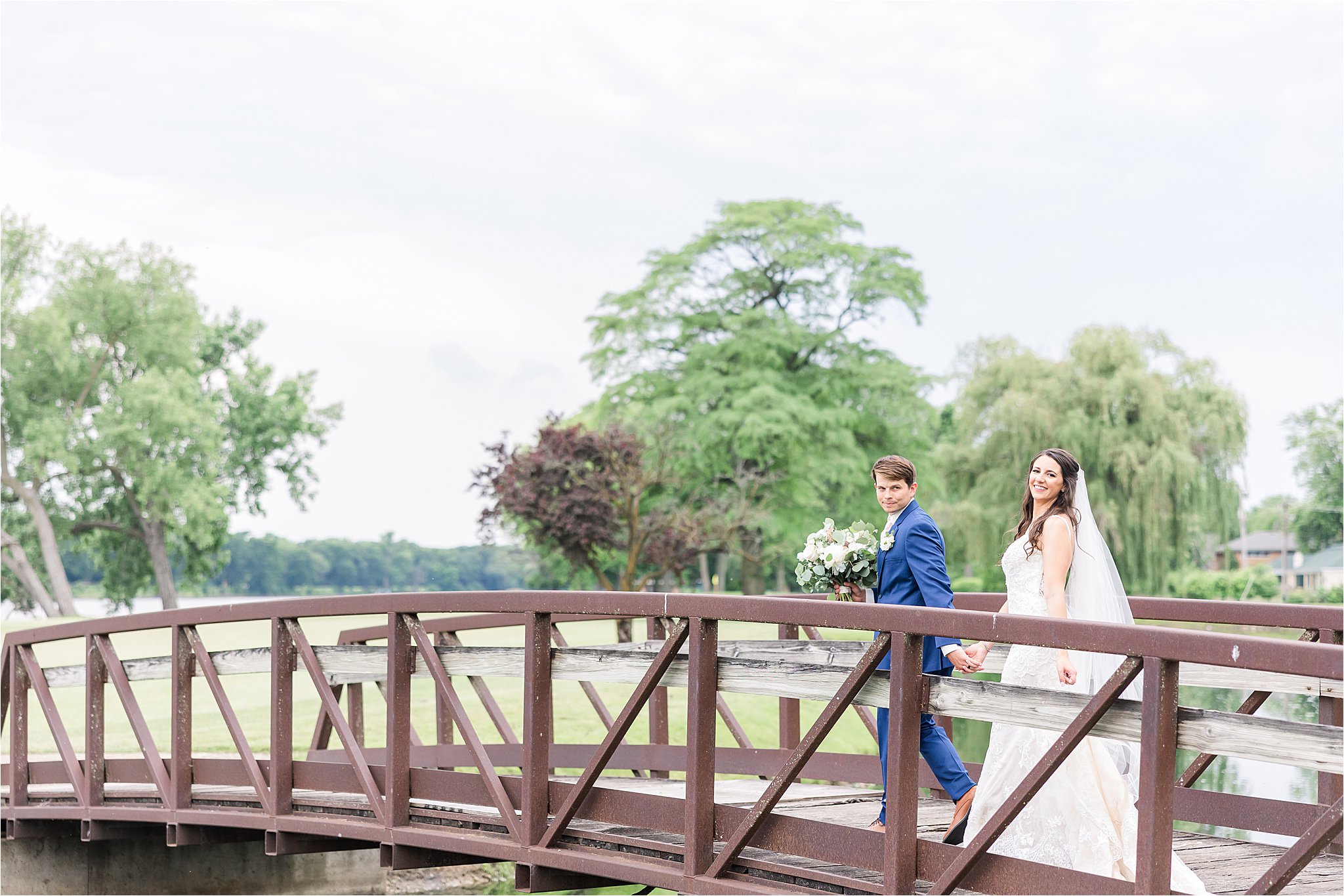 Bride and groom on a bridge at Kankakee Country Club Wedding